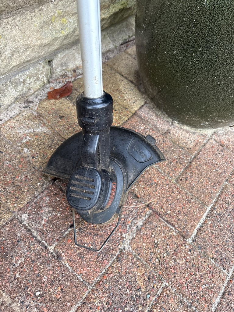 Black and Decker battery grass strimmer.