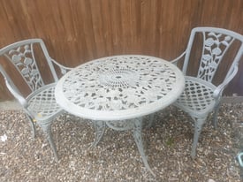Cast iron table with 2 chairs lovely set