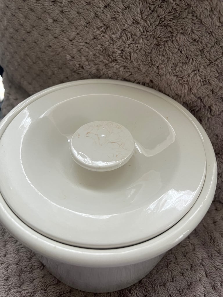 White ceramic jar with lid