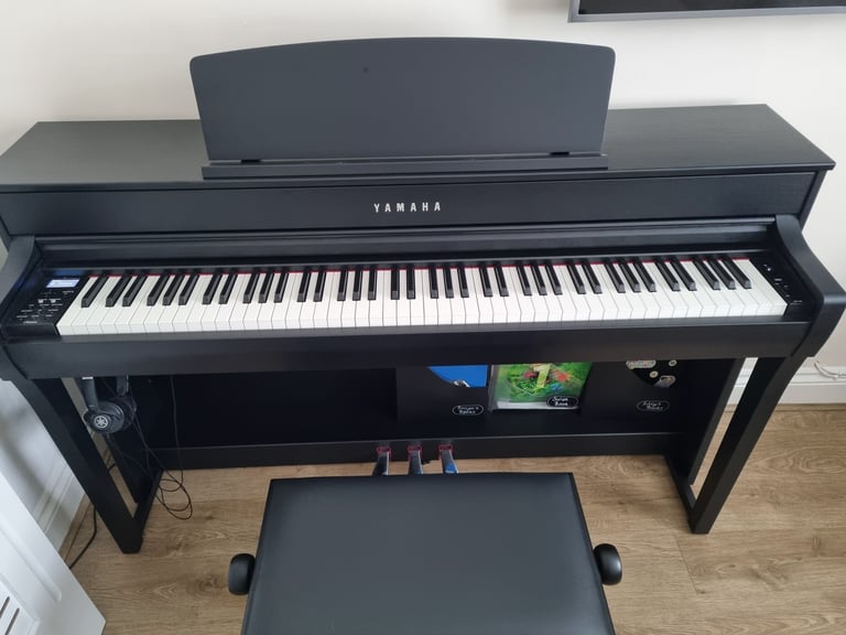 Yamaha Clavinova CLP745B EXCELLENT CONDITION. 1 YEAR OLD GOOD AS NEW. Stool and Yamaha Headphones