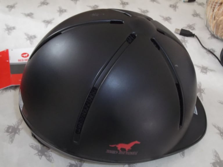 Childs horse riding safety helmet and storage bag