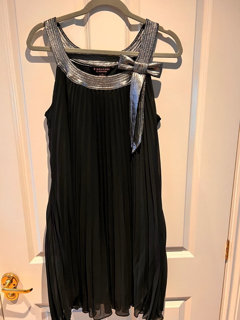 image for Black accordion dress with silver metallic collar and bow 