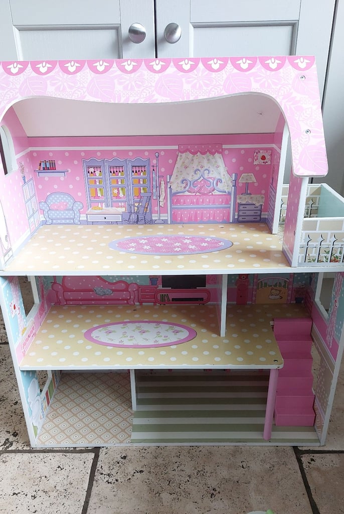 Wooden dolls house with furniture