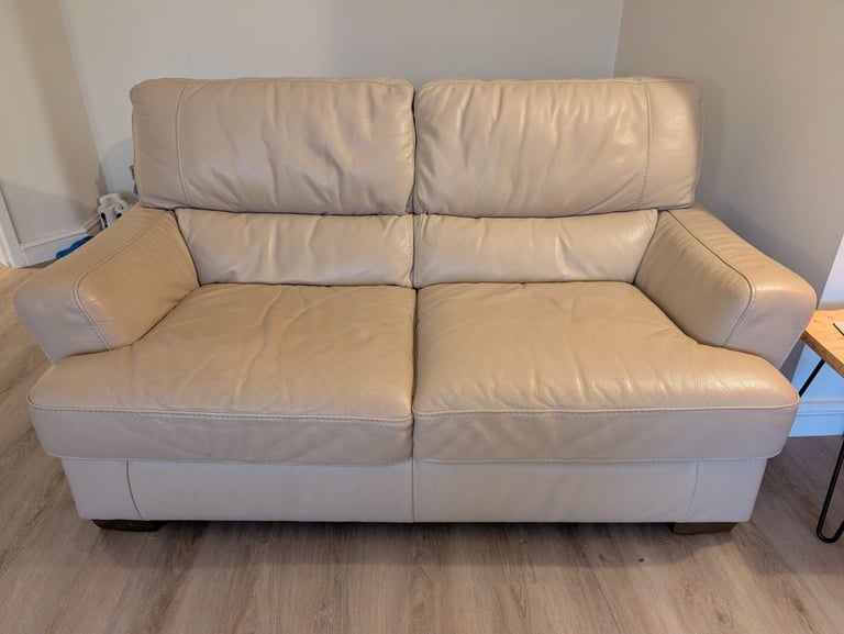 2 x leather sofas and 1 x footstool 