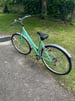 Mint Green city bike with wicker basket