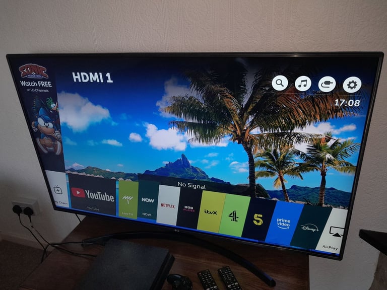 LG 55 inch 4K Ultra HD HDR Smart LED TV with two remotes
