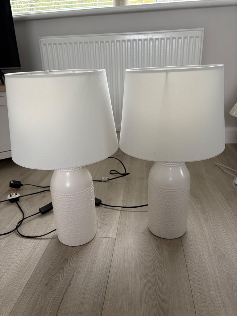 Two white lamps with textured bases