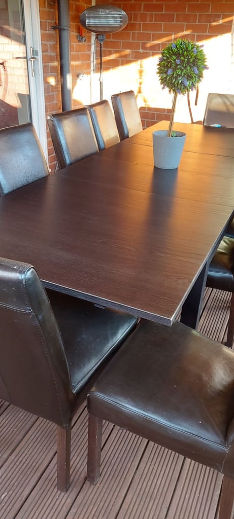 Large table and 12 brown chairs