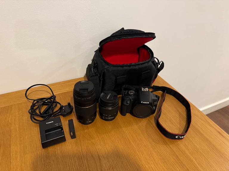 Canon EOS 2000D DSLR camera with two canon lenses.