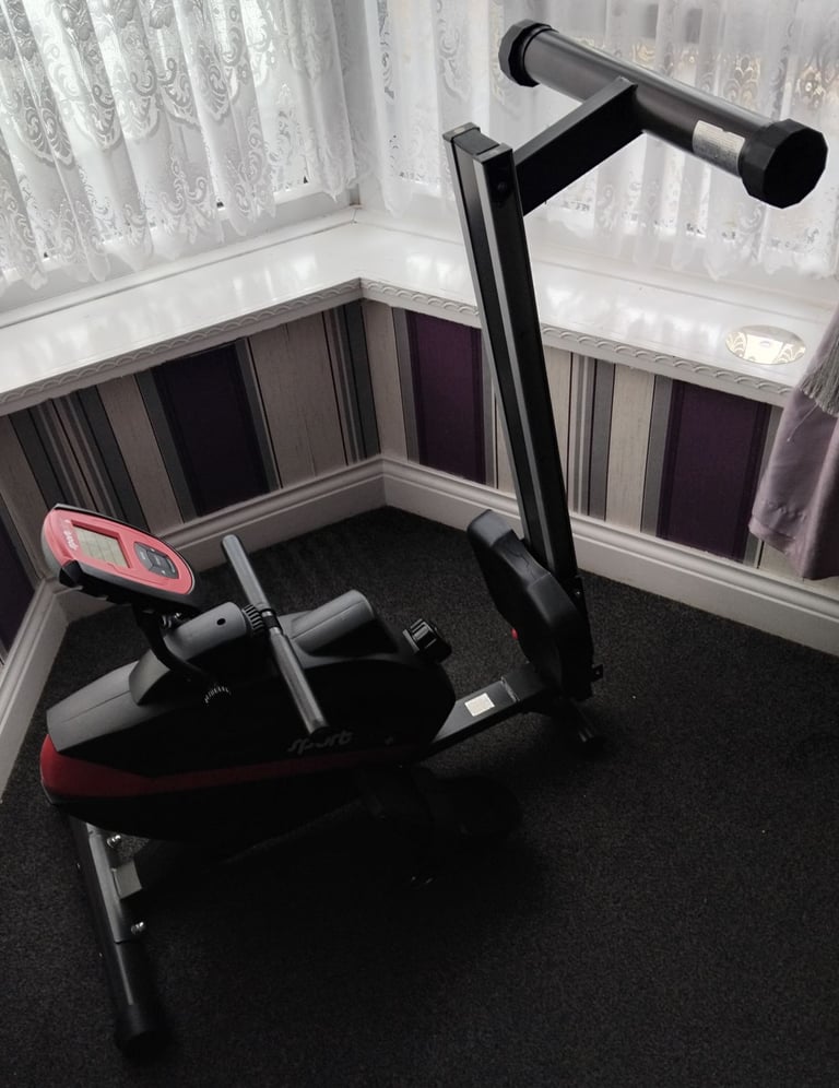 Rowing machine and weights bench
