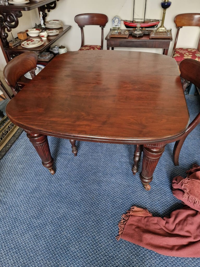 Victorian Mahogany dining table and four chairs.