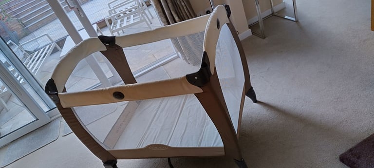 2 travel cots, sold separately