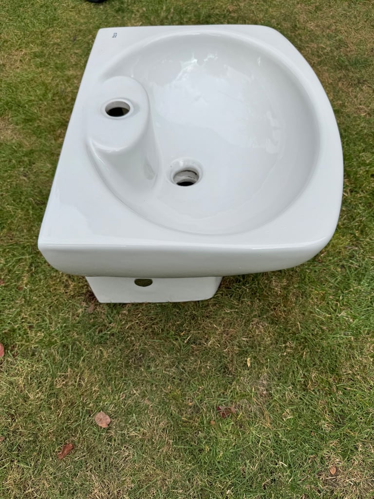 Roca brand white ceramic wall hanging cloakroom sink.  