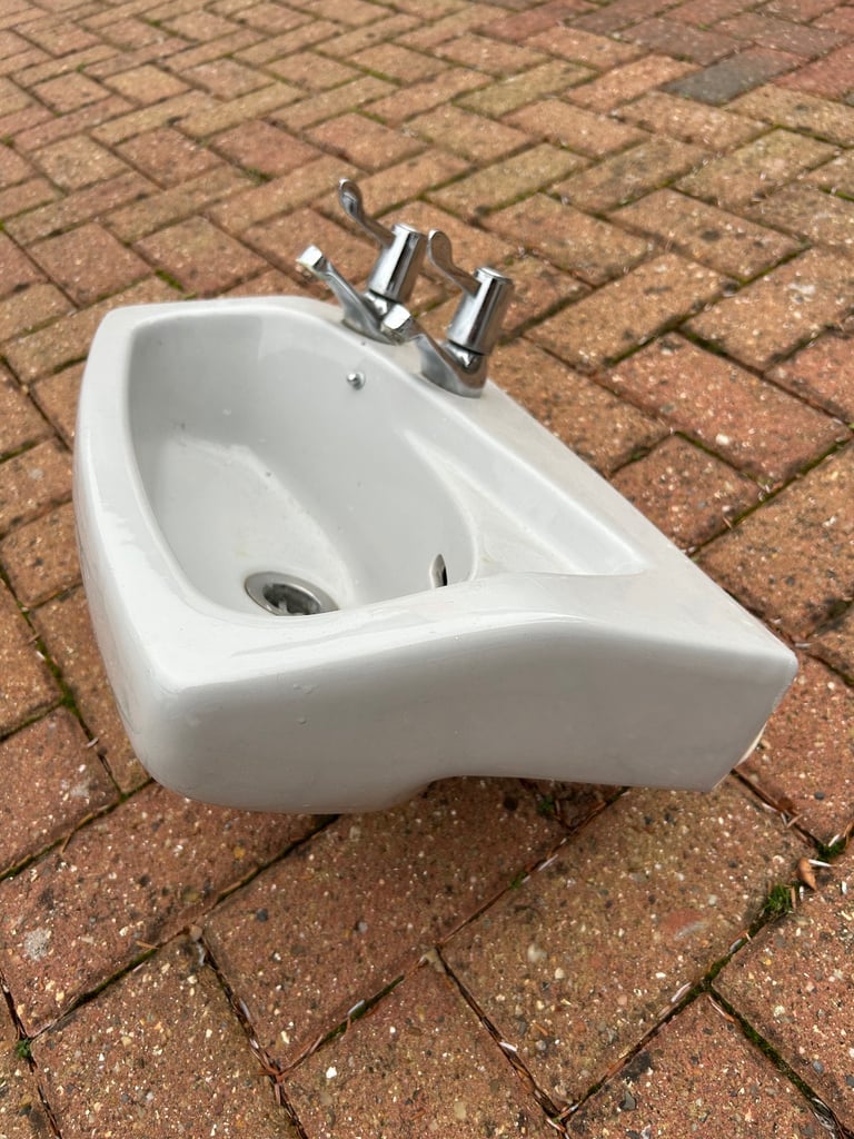 Small grey cloakroom basin sink with taps