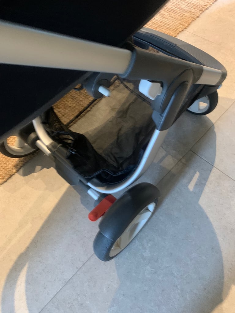  stokke transport system complete with carrycot and adjustable stroller seat black with spot trim