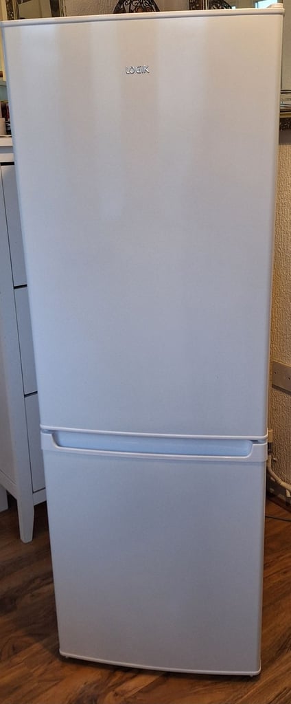 image for LOGIK fridge freezer size  H 142cm like new one year old 