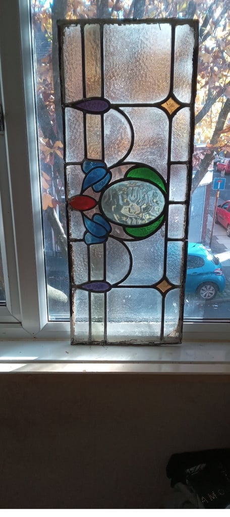 Beautiful coloured stained glass panel .