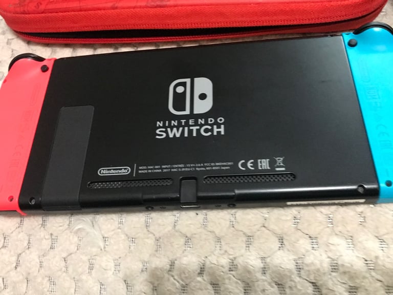 Nintendo Switch console with 3 games