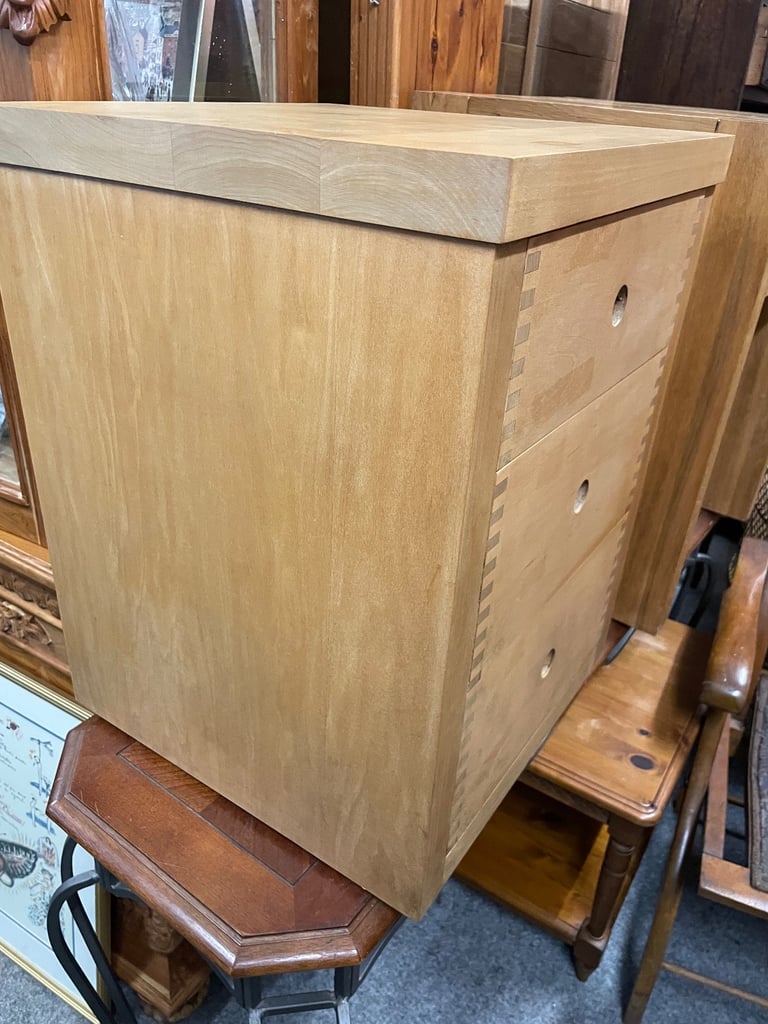 Solid wood, chest of three drawers.