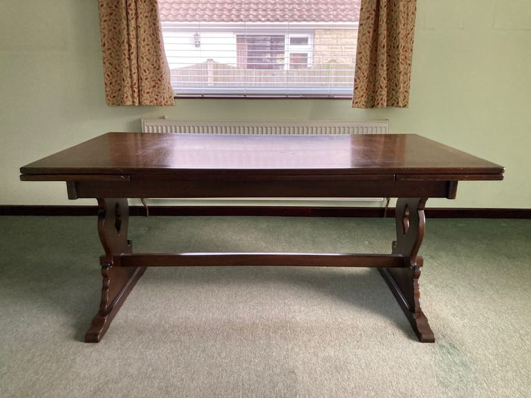 Dark mahogany finish dining table and six chairs