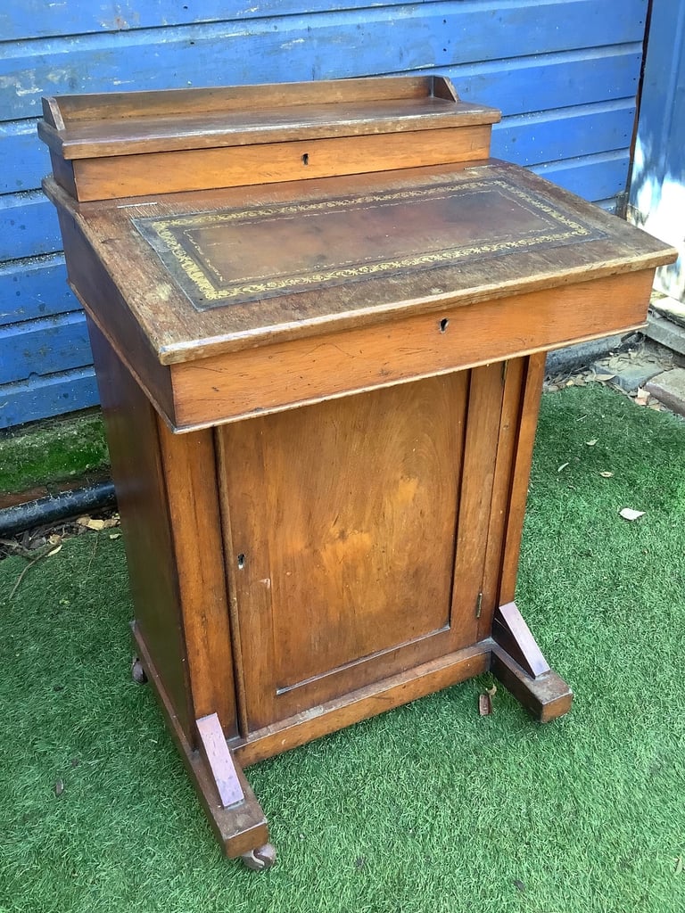 Victorian walnut brown leather insert davenport with ink wells & wheel castors