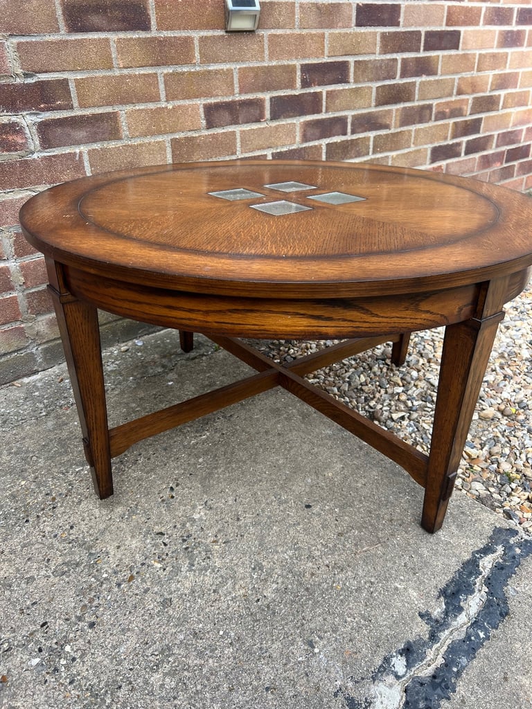Wooden table with glass inlays.