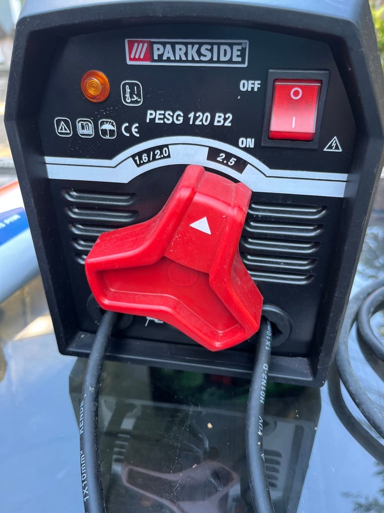 ARC WELDER + AUTO WELDING HELMET + BOX OF RODS