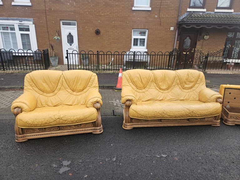Leather sofa in soild oak inset with matching footstool 