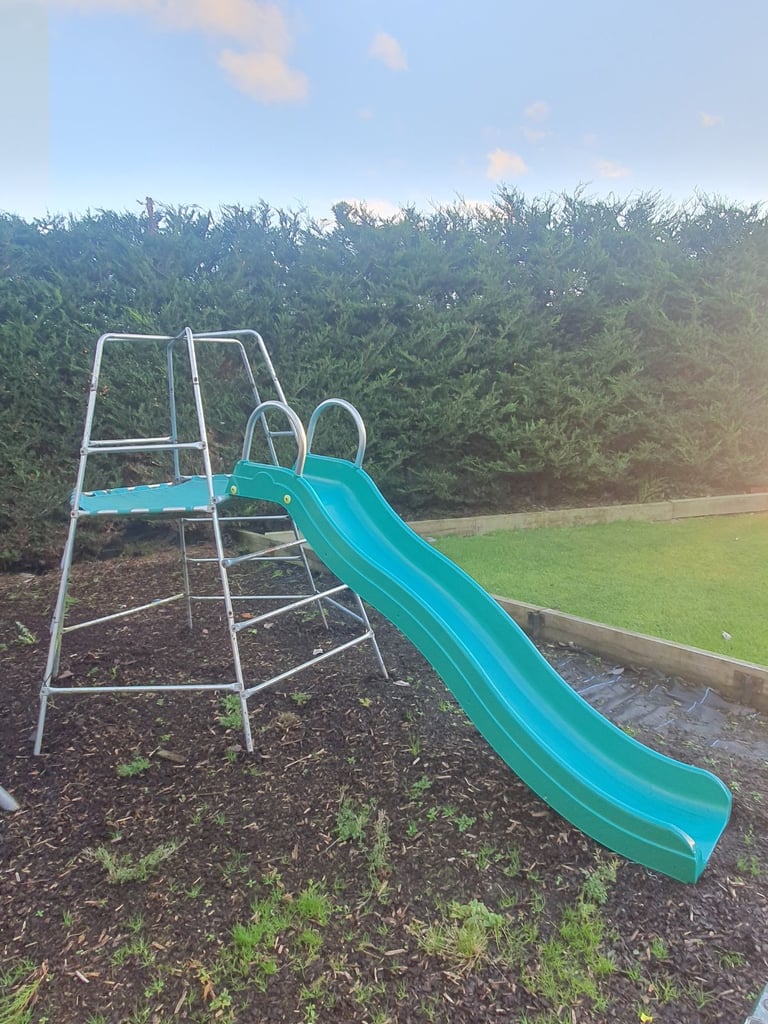 Climbing frame with slide