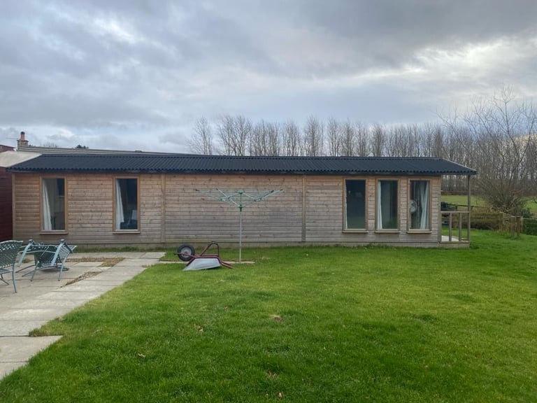 Sectional Wooden Lodge 12m x 3.6m (39ft x 12ft). Dismantled. Delivery available.
