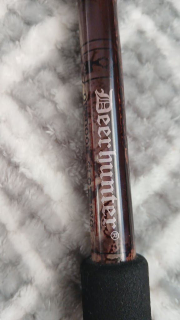 Dear hunter shooting stick