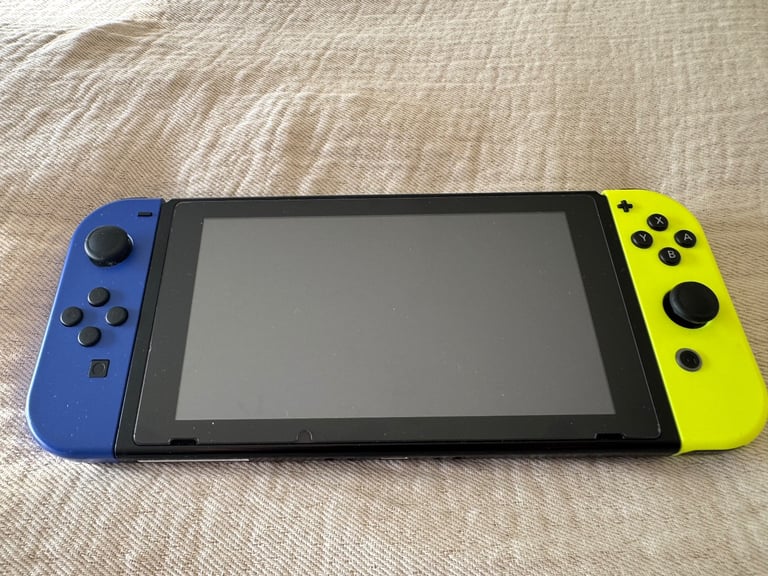image for Nintendo Switch with docking station, joycon grip, Pokemon case & 128Gb Samsung memory card. 
