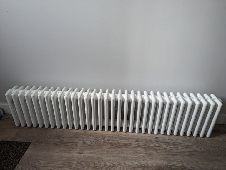 Rolled top white acova radiator 
