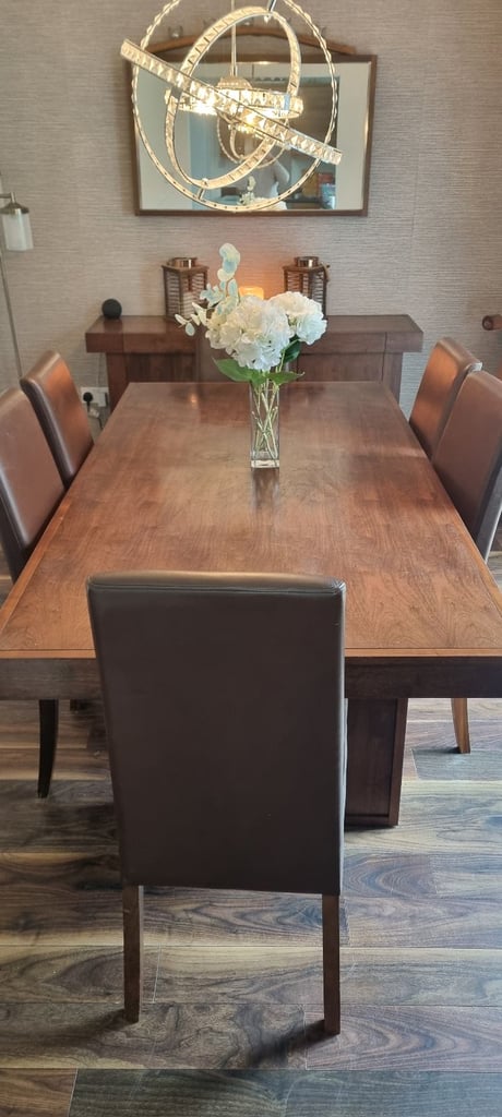 image for Solid walnut dining table and chairs
