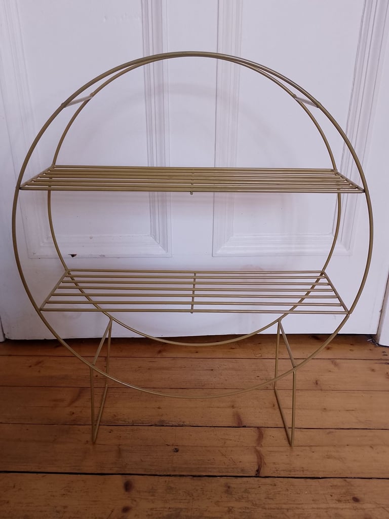 image for Matte gold circular freestanding bookshelf or plant stand. 