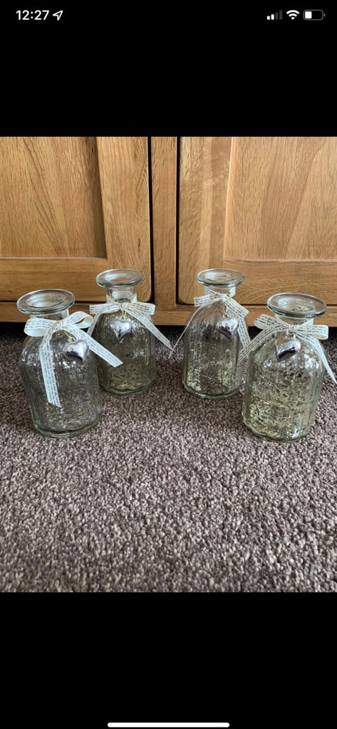 image for 4 x glass candle holders/vases with ribbons and metal bells