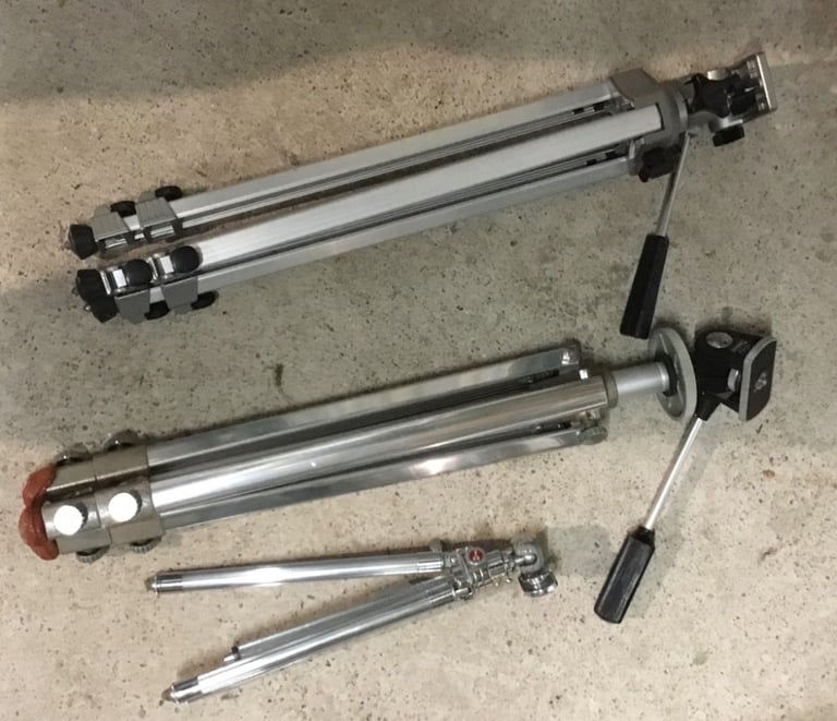 Three old but very good condition camera tripods.
