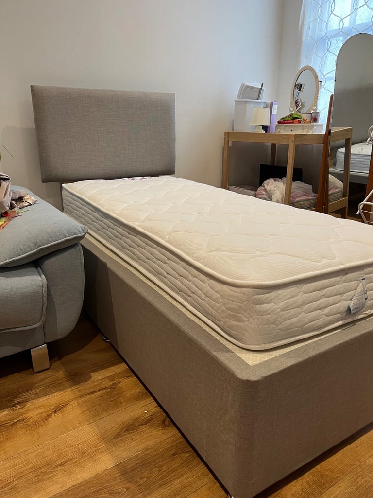 Single grey bed with new mattress 