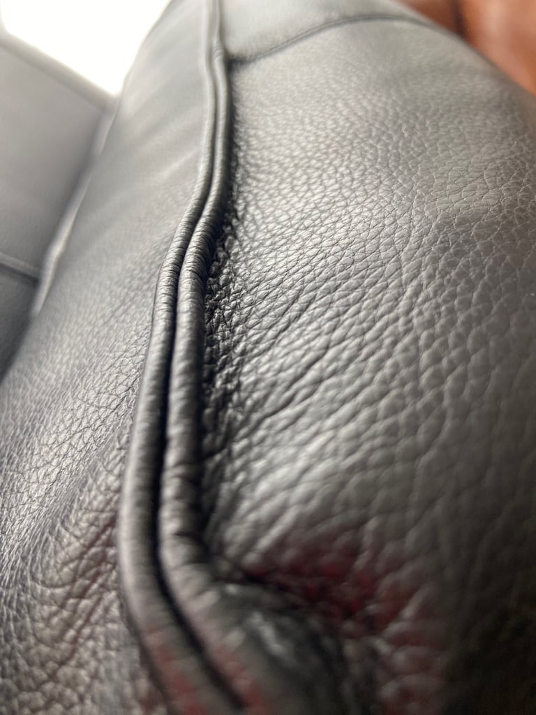 2 firm decorative leather pillows.