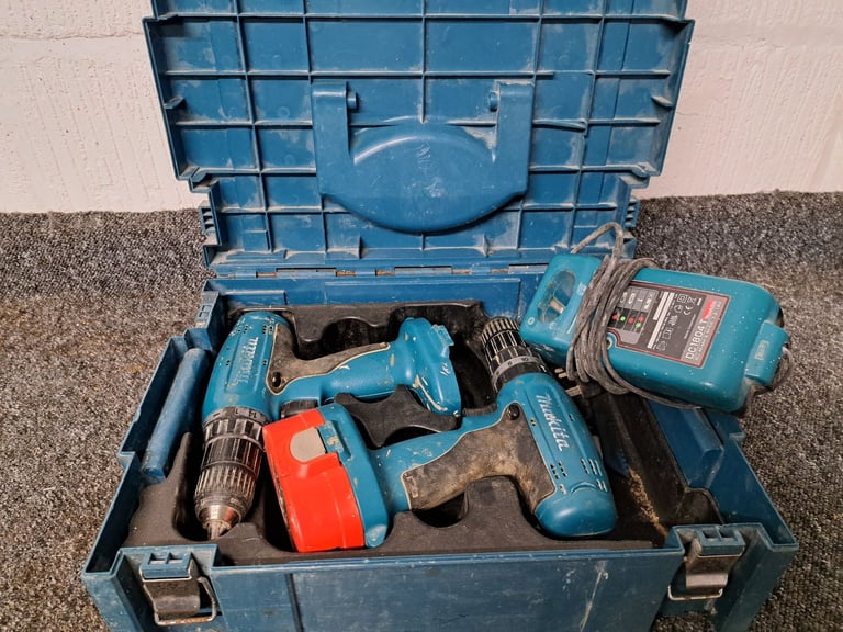 Two makita drills plus charger 