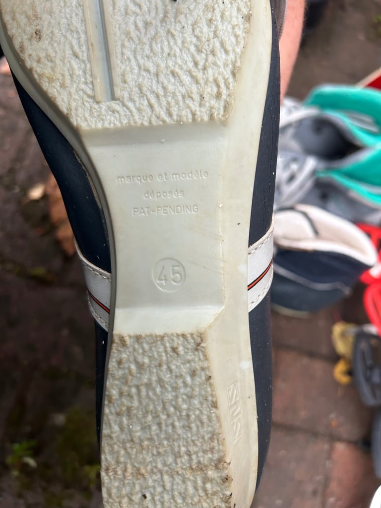 Various cross country skis, poles and boots