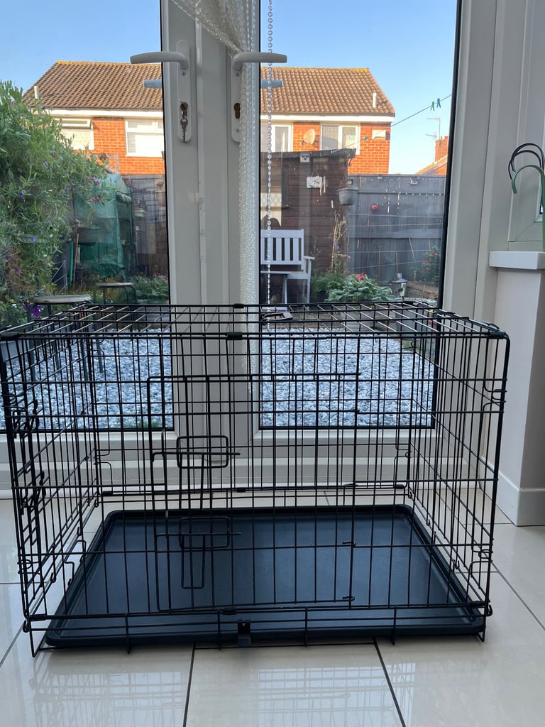 Black metal folding dog crate