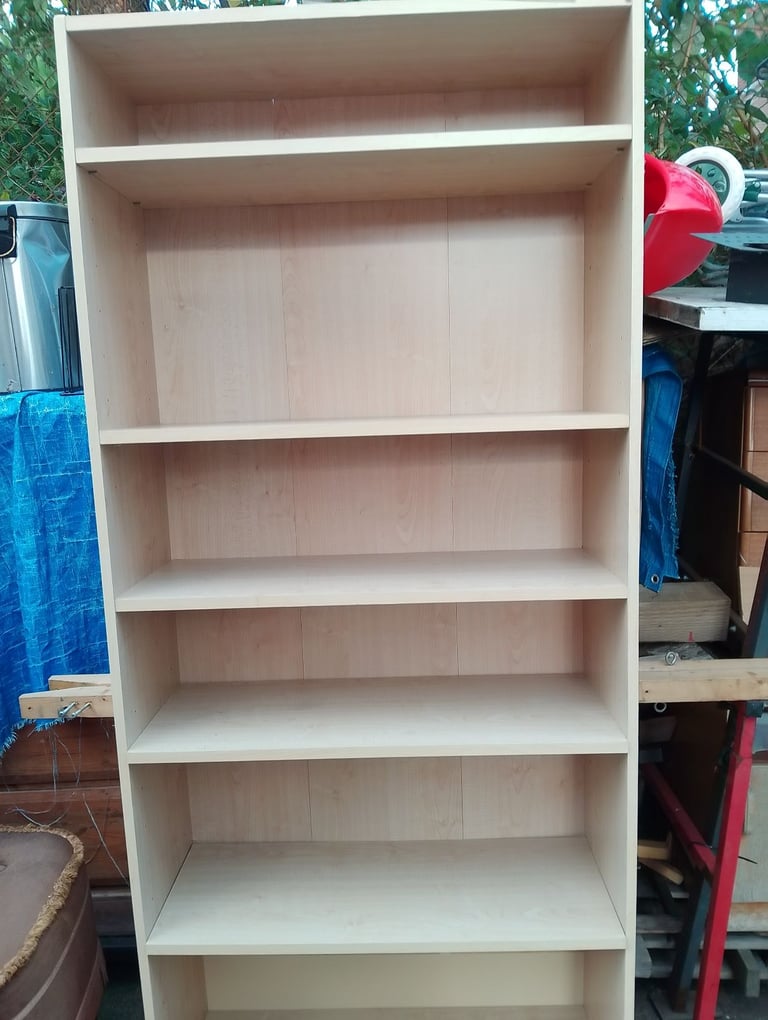 Very tall shelving unit in new condition spotlessly clean inside and out 