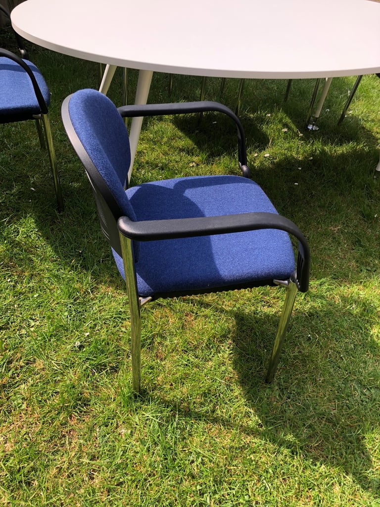 Conference table with 6 blue chairs 