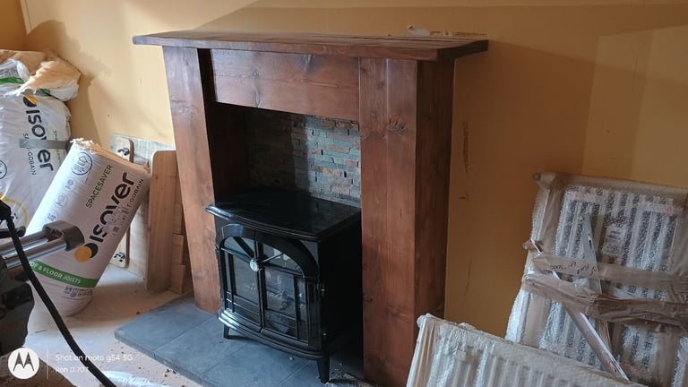 Dimplex Stocksbridge electric log effect stove with solid wood fire surround with tiled insert