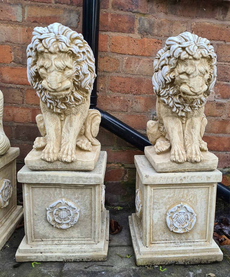 Pair of lions on Plinths