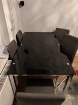 Black glass table and 6 chairs 