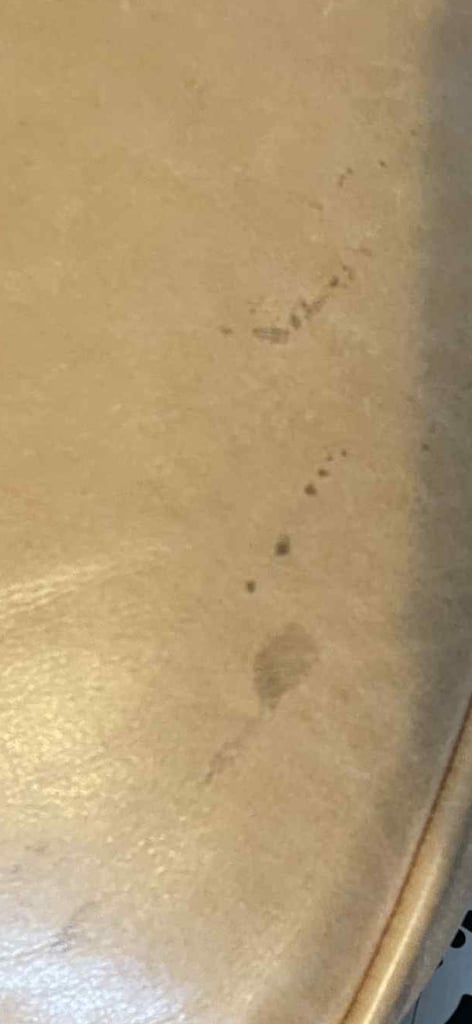 Tan Chesterfield sofa  and footstool 