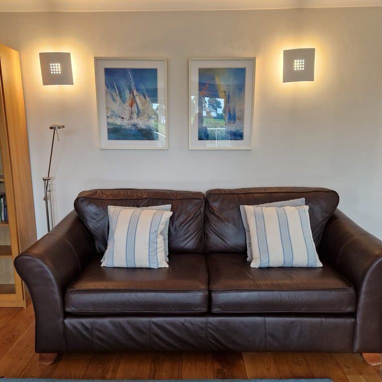 Two Marks and Spencers Abbey brown leather sofas