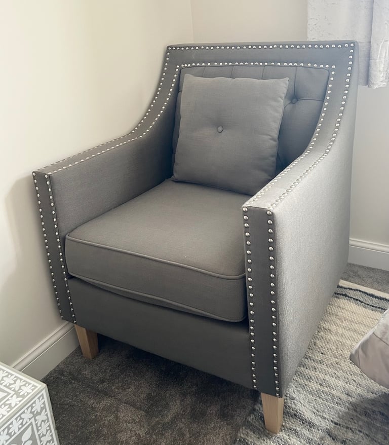 Grey studded armchair
